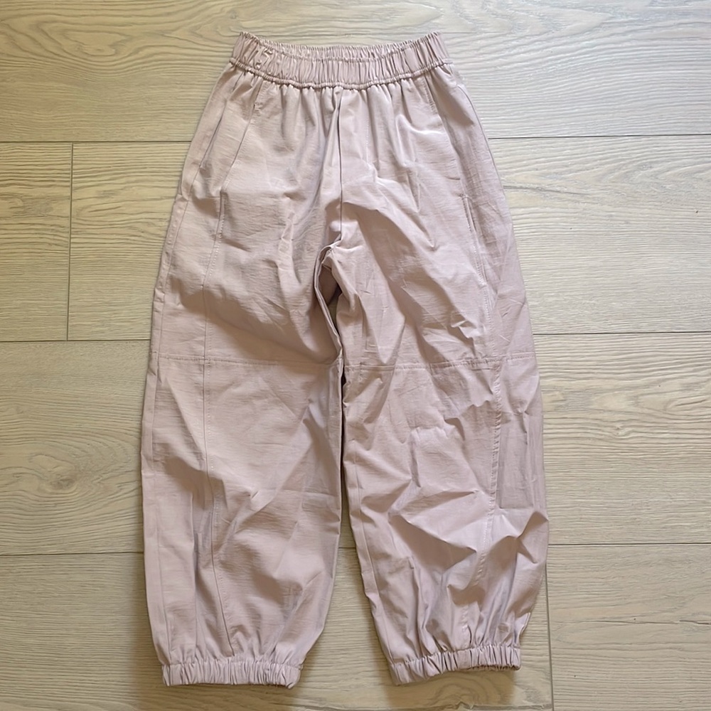 Girls rose colored parachute pants